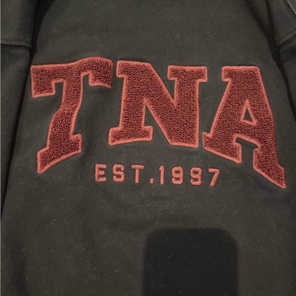TNA Women’s Black Crewneck Sweater with Burgundy Logo - Picture 2 of 3